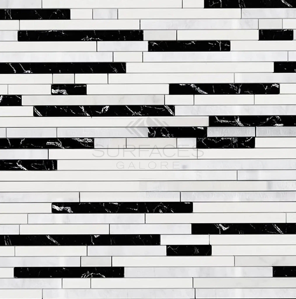 A wall with horizontal black and white rectangular tiles made from Oriental White marble, arranged in a repeating pattern, using SurfacesGalore's Oriental White / Asian Statuary Bamboo Sticks (Thassos+Oriental White+Black) Marble Mosaic Polished-Honed.