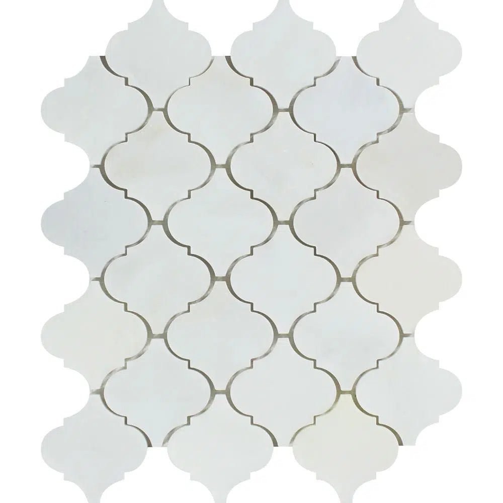 Patterned white tile backsplash featuring a luxurious Oriental White / Asian Statuary Lantern 3-inch Marble Mosaic Polished-Honed design by SurfacesGalore.