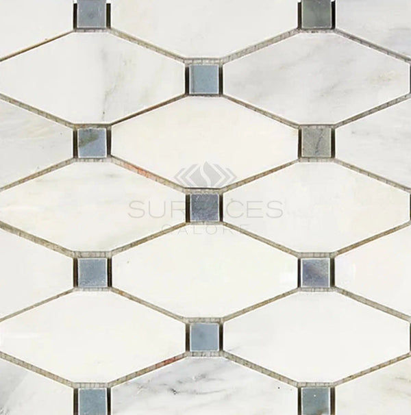 The Oriental White / Asian Statuary Octave (Long Octagon) Marble Mosaic Polished-Honed tiles from SurfacesGalore feature a hexagonal shape with small blue-gray square insets, creating a classic geometric pattern. "Surfaces" logo in center.