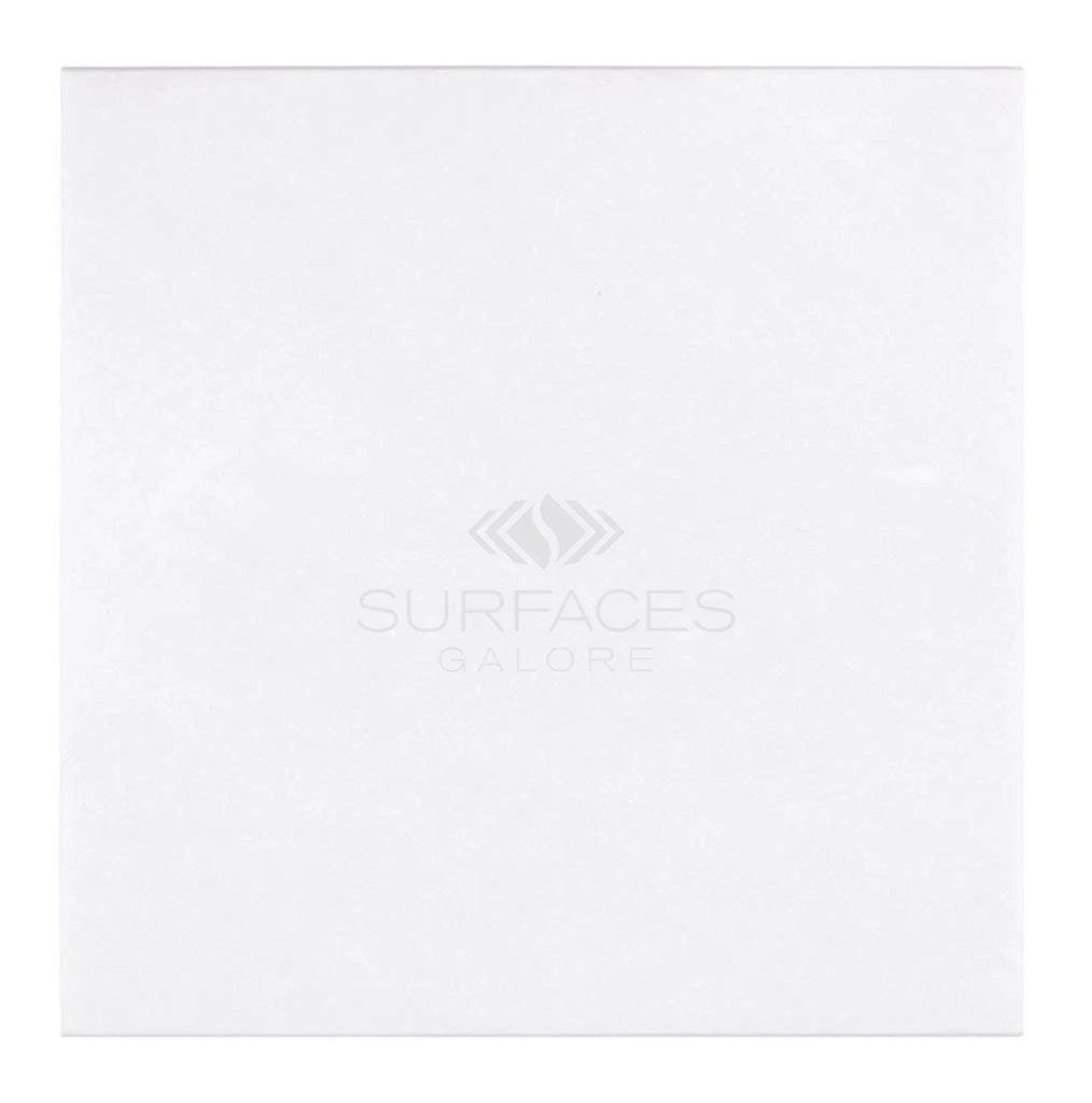 A Thassos White (Greek) 18X18 Marble Polished-Honed rectangular surface with the text "SurfacesGalore" and a logo in the center.