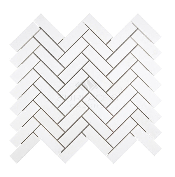 Herringbone pattern with SurfacesGalore's Thassos White (Greek) 1X3 Herringbone Mosaic Marble Polished-Honed tiles that boasts a pure white color on a white background.