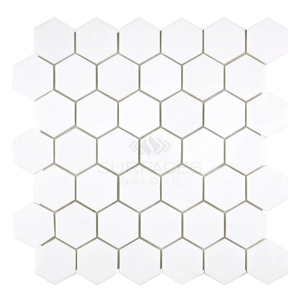 SurfacesGalore's Thassos White (Greek) 2X2 Hexagon Mosaic Marble Polished-Honed tiles, arranged in a honeycomb pattern on a square grid background.