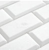 White, rectangular Thassos White (Greek) 2X4 deep-beveled brick mosaic marble tiles with a polished-honed finish, arranged in a staggered pattern. Text reads "SurfacesGalore," offering a luxurious look reminiscent of Thassos White Marble.