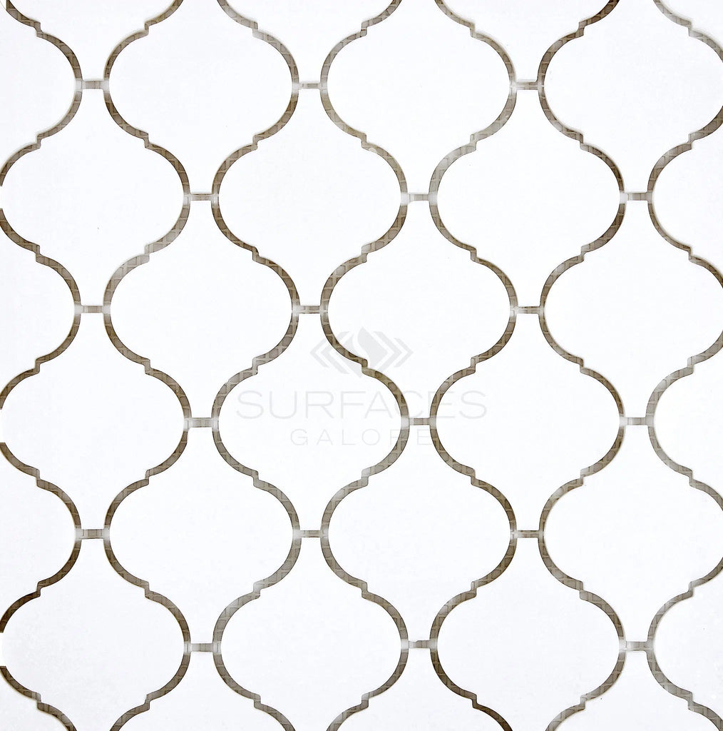 Thassos White (Greek) 3 inch Lantern Mosaic Marble Polished-Honed tiles featuring a white arabesque pattern accented with gray grout lines and the SurfacesGalore logo in the center.