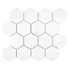 The Thassos White (Greek) 3X3 Hexagon Mosaic Marble Polished-Honed tiles from SurfacesGalore, arranged in a honeycomb pattern, provide a luxurious appearance on any flat surface.