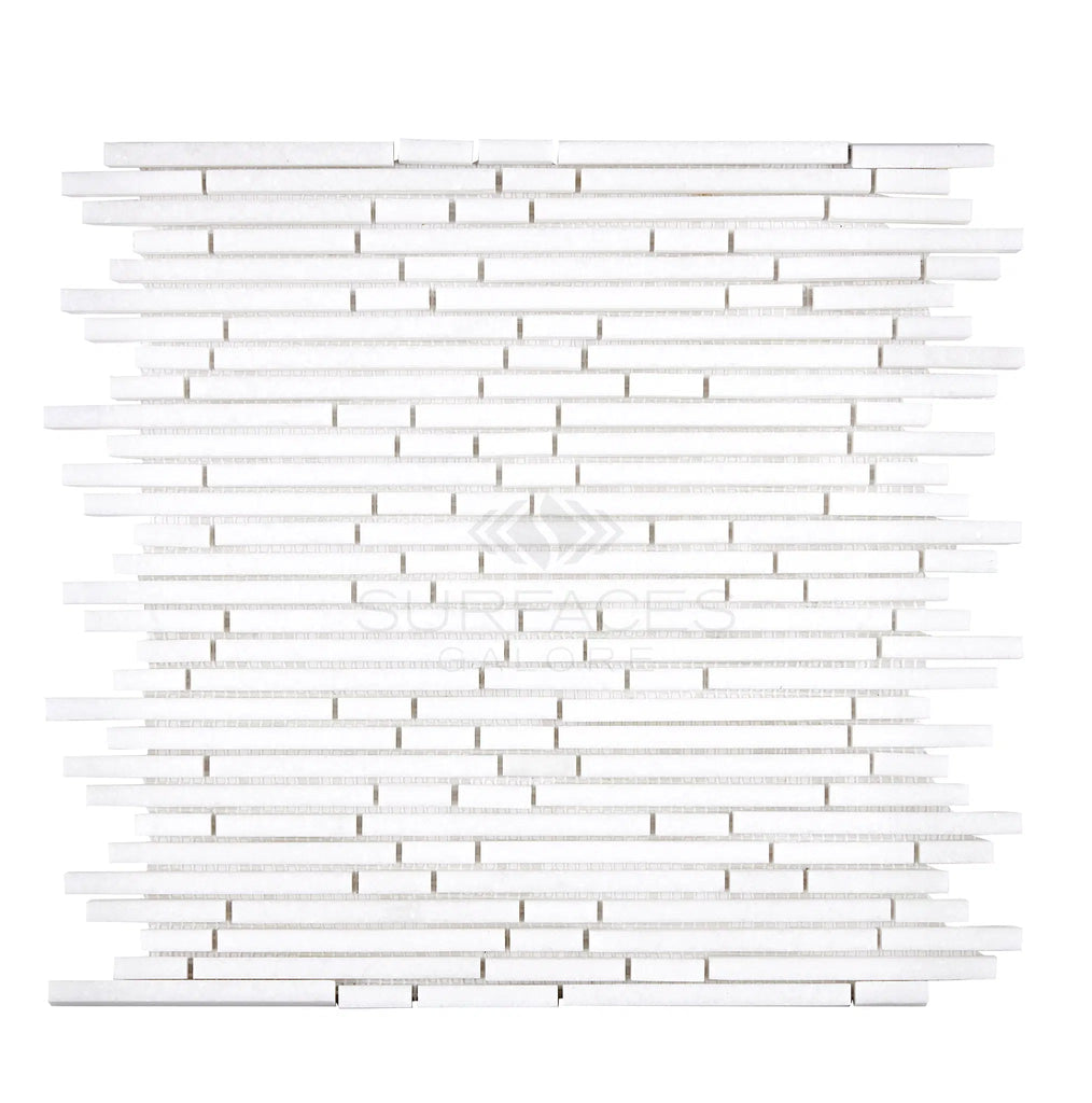 The Thassos White (Greek) Bamboo Sticks Mosaic Marble Polished-Honed from SurfacesGalore features a white, rectangular pattern of varying lengths and widths arranged in horizontal rows, showcasing the elegance of Thassos White Marble.