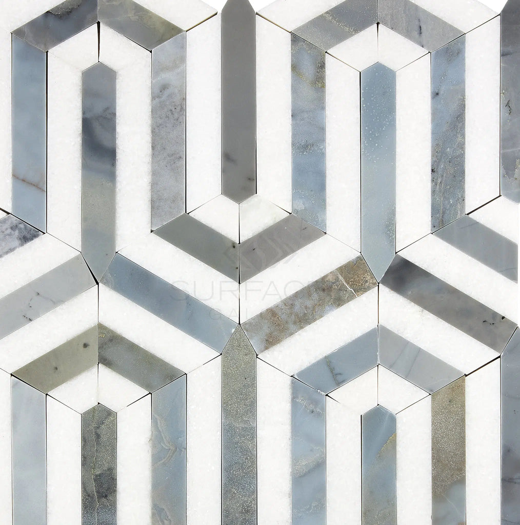 The Thassos White (Greek) Berlinetta Design (w/ Blue-Gray) Mosaic Marble Polished-Honed from SurfacesGalore features a striking geometric pattern of hexagonal shapes in varying shades of white, gray, and blue, reminiscent of Thassos White Marble and creating a 3D illusion.