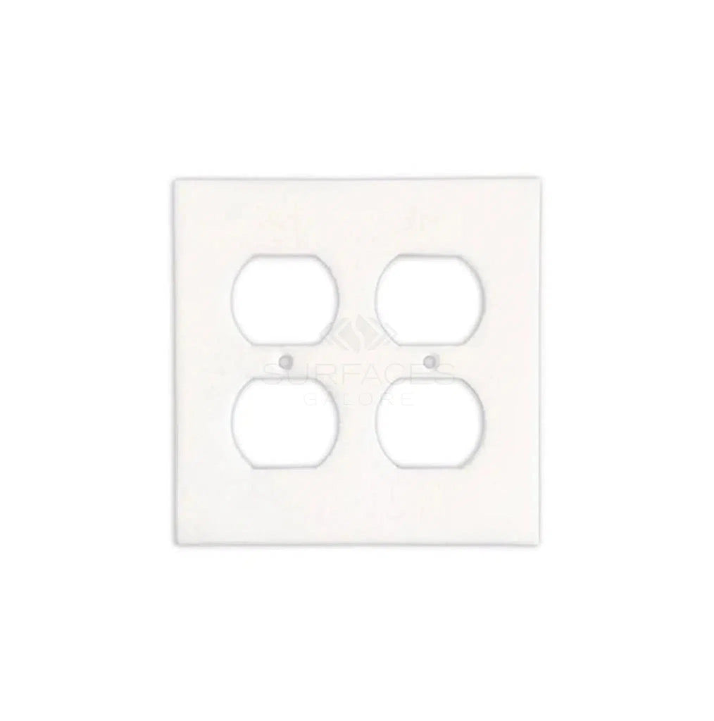 Introducing the Thassos White Marble Double DUPLEX Switch Wall Plate from SurfacesGalore, featuring an elegant design with two rows of rectangular openings. Perfect for any room, this sophisticated white wall plate is ideal for upgrading your switch plate or wall plate covers, seamlessly blending into your decor. Elevate its allure by choosing the authentic marble finish for a luxurious touch.