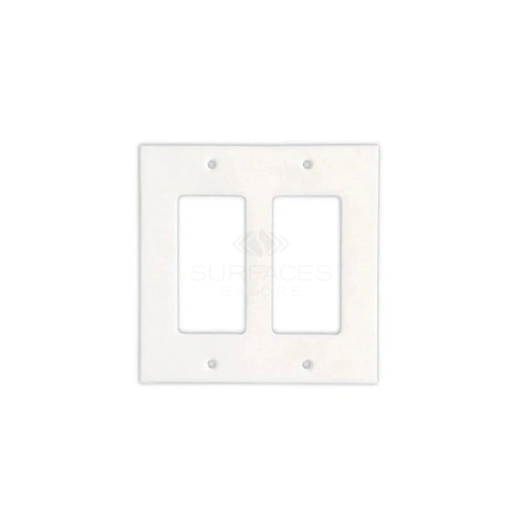 The Thassos White Marble Double ROCKER Switch Wall Plate from SurfacesGalore is a two-gang wall plate with openings for two rocker switches. It includes screws and features a white, marble design that adds a touch of natural stone decor to your home.