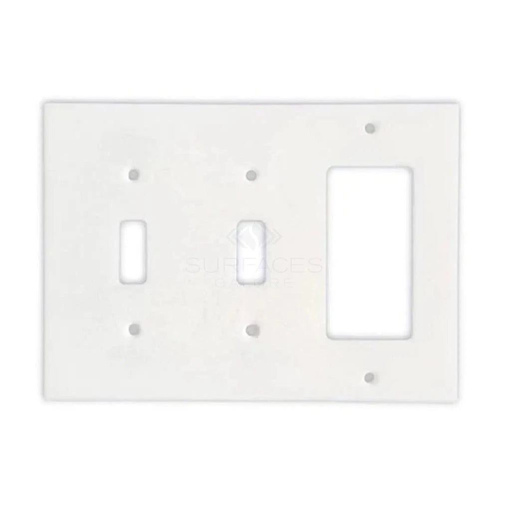 The Thassos White Marble Double TOGGLE - ROCKER Switch Wall Plate from SurfacesGalore features two openings: one for a toggle switch and the other for a rectangular outlet. This natural stone switch plate cover adds an elegant touch to any room.