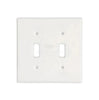 A luxurious home decor piece, the Thassos White Marble Double TOGGLE Switch Wall Plate from SurfacesGalore features two rectangular openings for switches, blending seamlessly into a pristine white background.