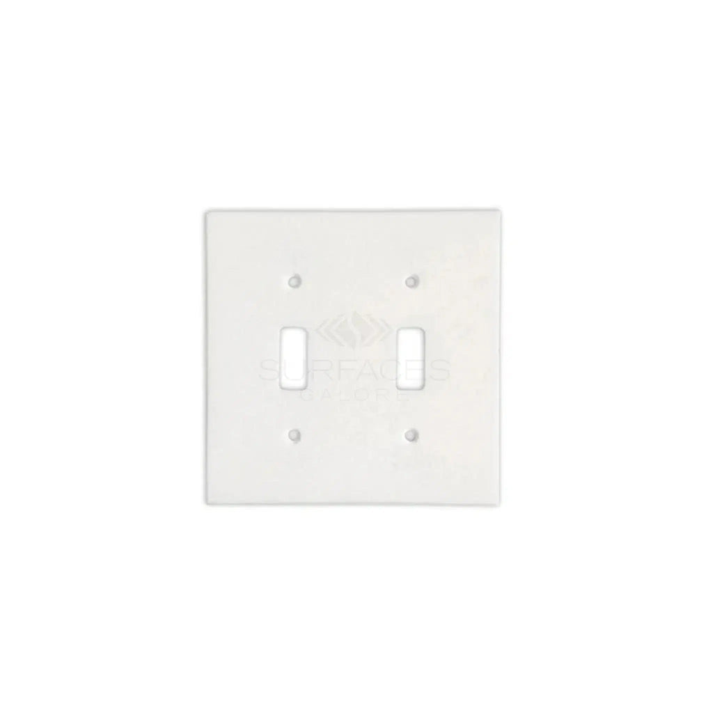 A Thassos White Marble Double TOGGLE Switch Wall Plate from SurfacesGalore, set against a pristine white background.