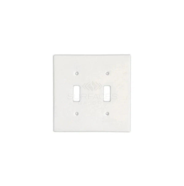 A Thassos White Marble Double TOGGLE Switch Wall Plate from SurfacesGalore, set against a pristine white background.