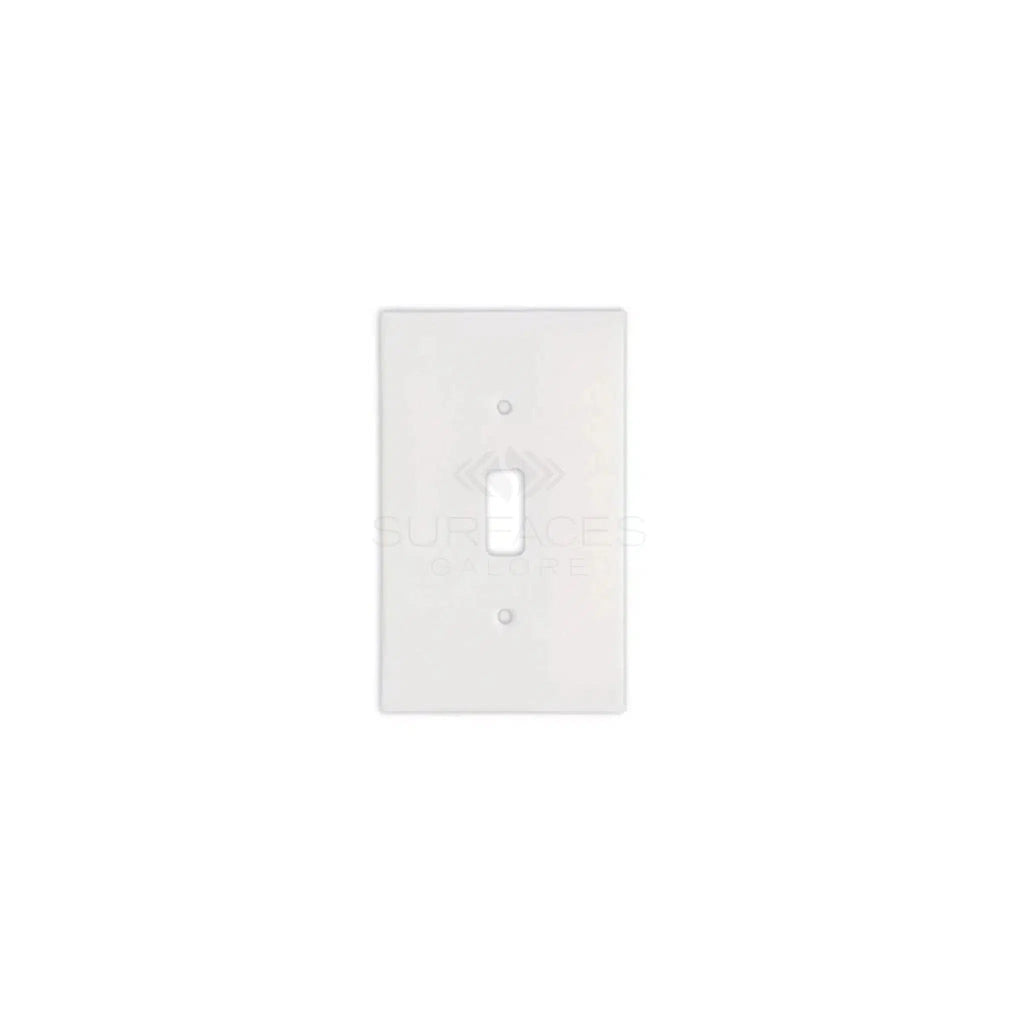 A Thassos White Marble Single TOGGLE Plate Switch Wall Plate by SurfacesGalore, crafted to emulate authentic marble with a central toggle switch opening, set against a white background.