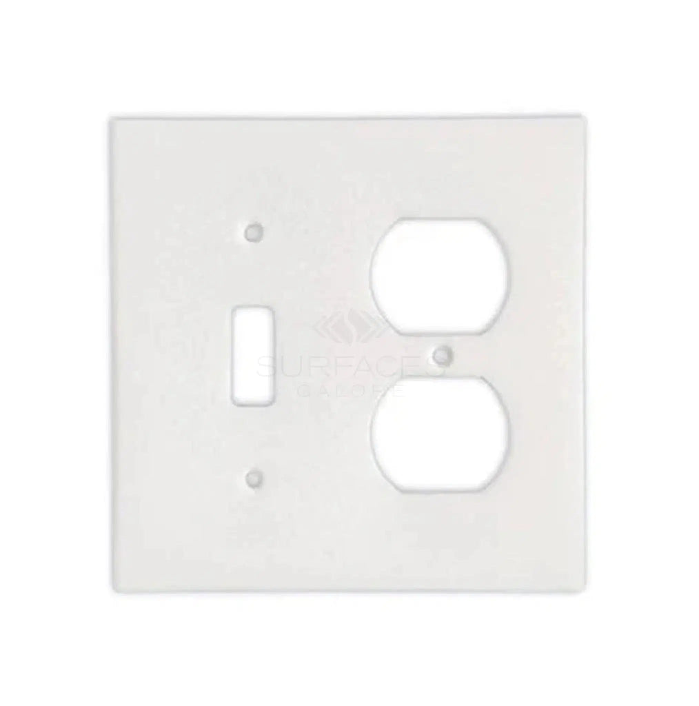 The Thassos White Marble TOGGLE - DUPLEX Switch Wall Plate/Cover Plate/Switch Plate by SurfacesGalore is a white outlet cover plate featuring spaces for a switch on the left and a double socket on the right, designed to mimic the elegance of authentic marble wall plate covers.