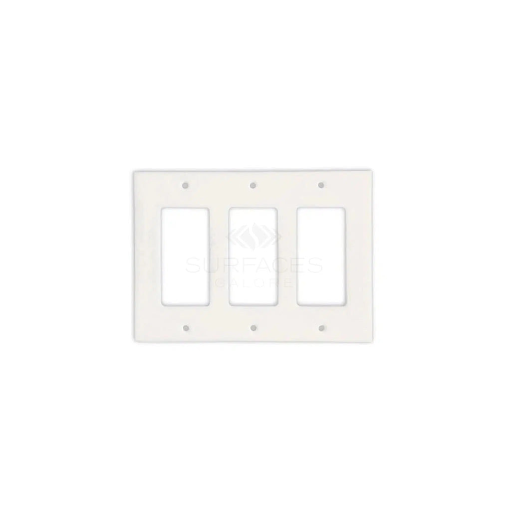 The Thassos White Marble Triple ROCKER Plate Switch Wall Plate / Cover Plate / Switch by SurfacesGalore, featuring elegant rectangular openings, is mounted on a plain white background. This switch plate cover boasts a sleek and modern design that seamlessly blends into any decor.