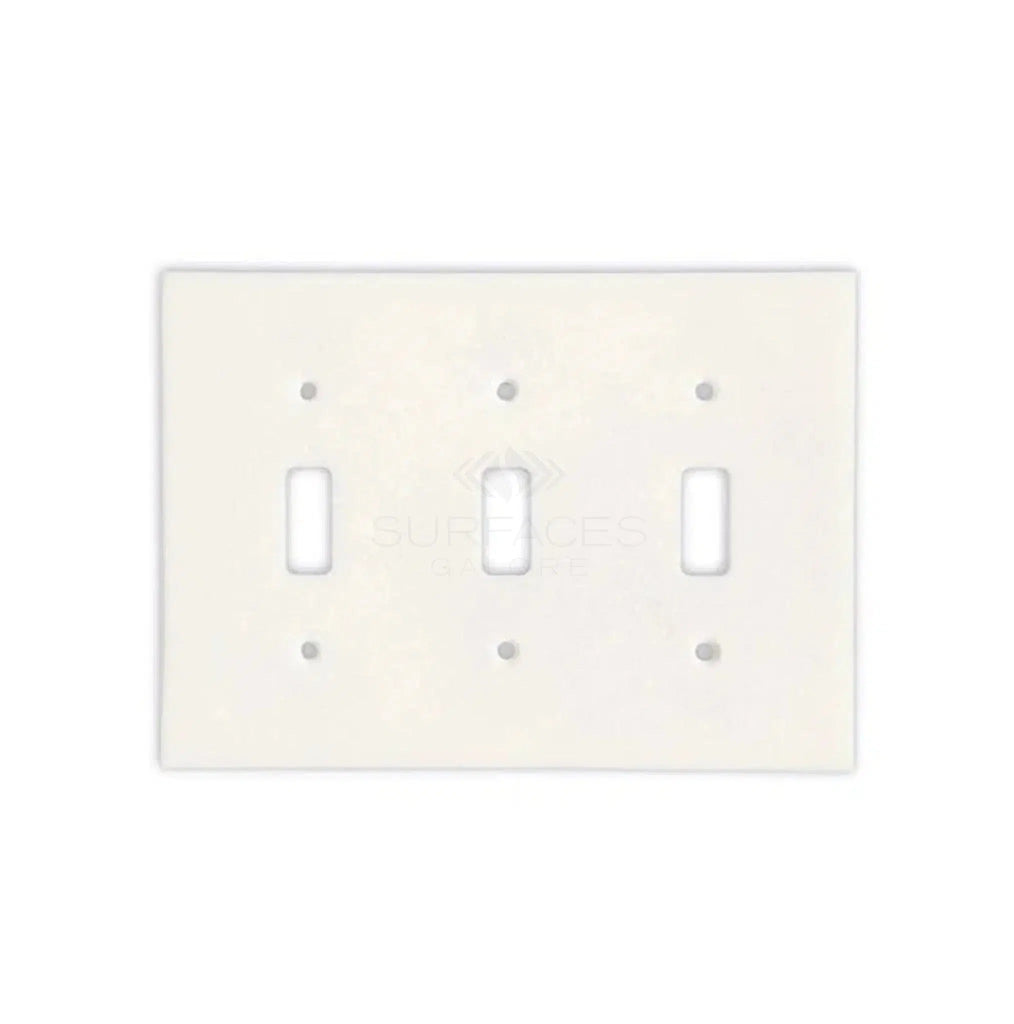 Introducing the Thassos White Marble Triple TOGGLE Plate Switch Wall Plate by SurfacesGalore, a luxurious light switch plate in pristine white with three toggles. This elegant wall plate features rounded edges and six screw holes, meticulously crafted from natural stone to provide an authentic marble look. Ideal for enhancing luxury home decor.