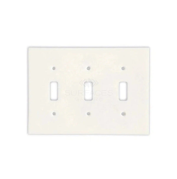 Introducing the Thassos White Marble Triple TOGGLE Plate Switch Wall Plate by SurfacesGalore, a luxurious light switch plate in pristine white with three toggles. This elegant wall plate features rounded edges and six screw holes, meticulously crafted from natural stone to provide an authentic marble look. Ideal for enhancing luxury home decor.