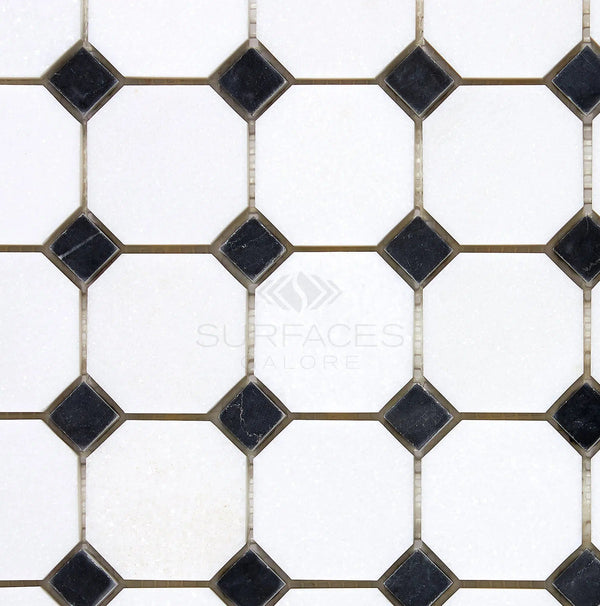 Hexagonal black and white tile pattern featuring the "SurfacesGalore" logo in the center, part of the elegant Thassos White (Greek) Octagon (w/ Black) Mosaic Marble Polished-Honed Collection.