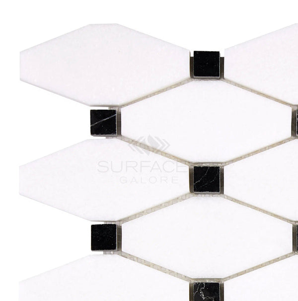 A hexagonal white and black tile pattern featuring black square accents at the vertices, resembling a crystalline texture, with the text "SurfacesGalore" visible. Product Name: Thassos White (Greek) Octave (Long Octagon) (w/ Black) Mosaic Marble Polished-Honed from SurfacesGalore.