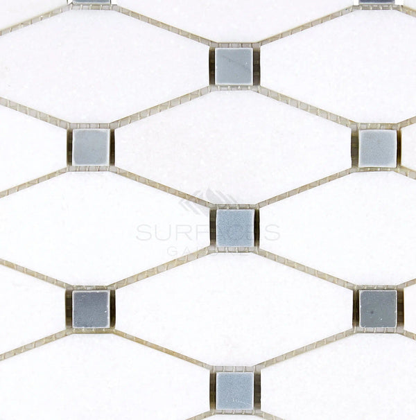 Thassos White (Greek) Octave (Long Octagon) Mosaic Marble Polished-Honed by SurfacesGalore features a geometric pattern of hexagonal white tiles with blue-gray accents at each corner, echoing the pristine color of Thassos White Marble.