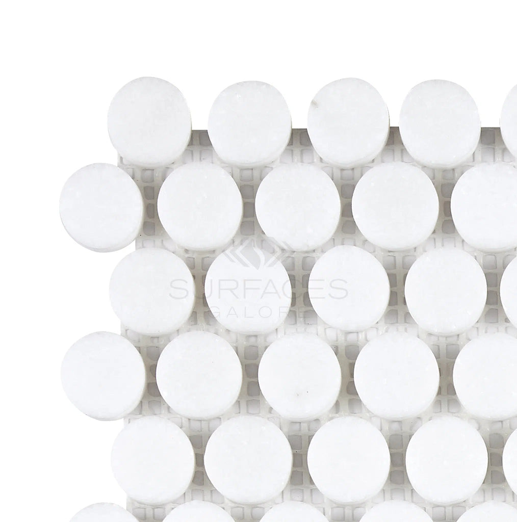 Close-up of a white circular tile pattern with a textured surface on a white background, reminiscent of the Thassos White (Greek) Penny-Round Mosaic Marble Polished-Honed from SurfacesGalore.