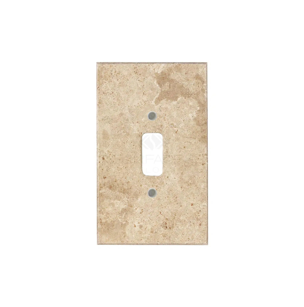 Genuine Walnut Travertine wall plate by SurfacesGalore, presenting a single white toggle switch at its center with natural stone variations against a white background.