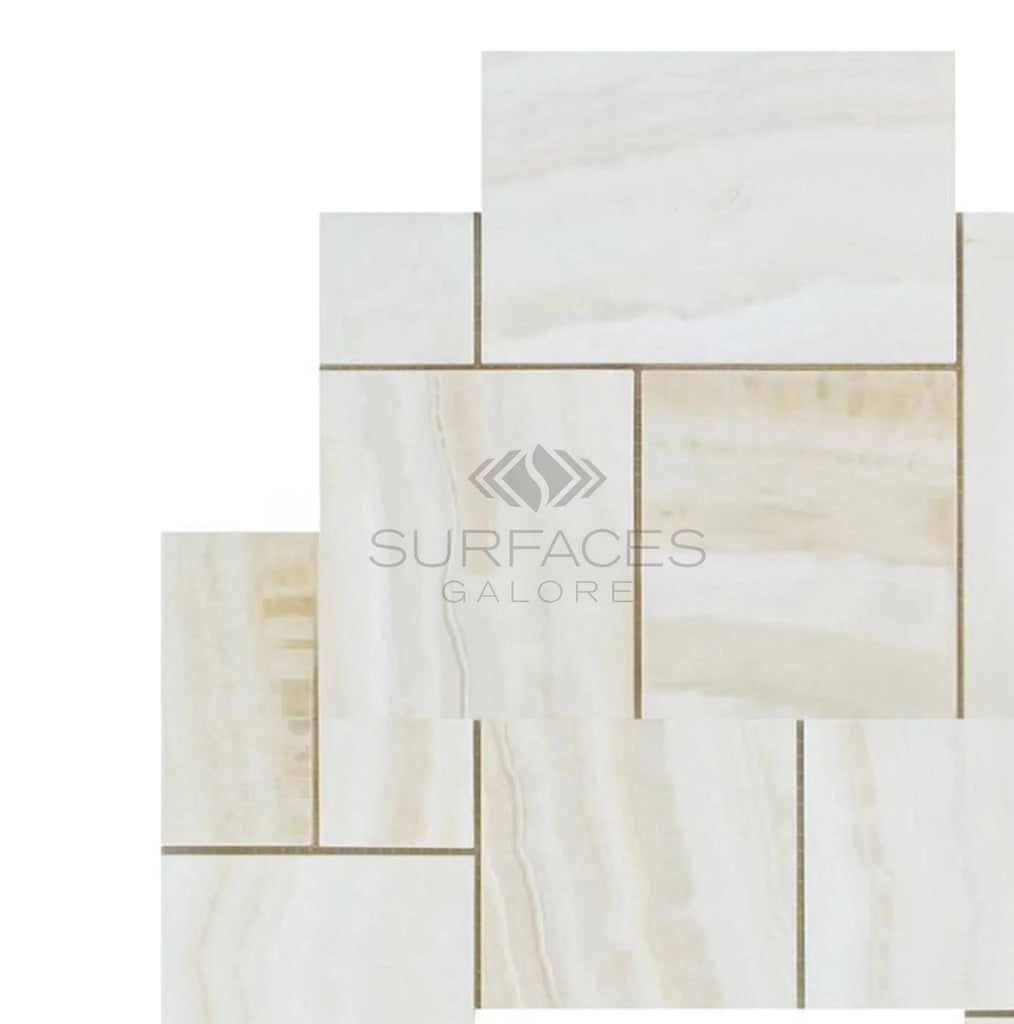 A display of White Onyx (Bianco-Vanilla) OPUS 4 pcs. Mini Pattern (Vein-Cut) Premium Mosaic Marble Tile Polished arranged in a staggered pattern, showcasing premium quality craftsmanship, with 'SurfacesGalore' text overlay.