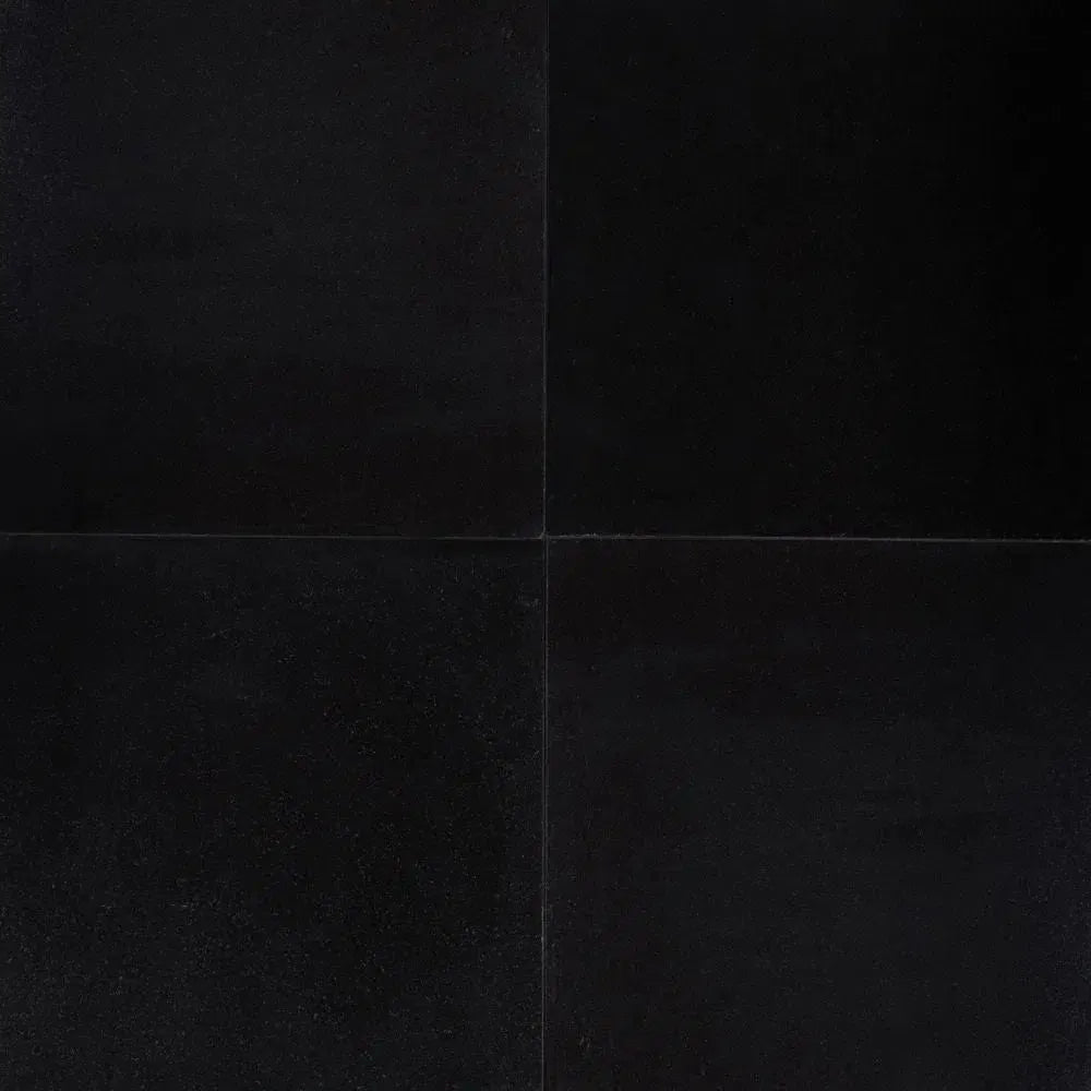 Folded black paper showcasing Absolute Black 18X18 Granite Polished texture