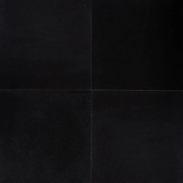 Folded black paper showcasing Absolute Black 18X18 Granite Polished texture