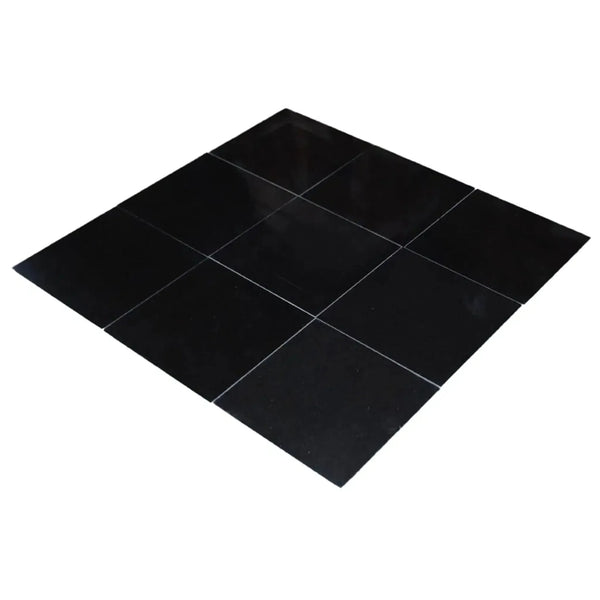 Nine black square tiles of Absolute Black 24X24 Granite Polished on display