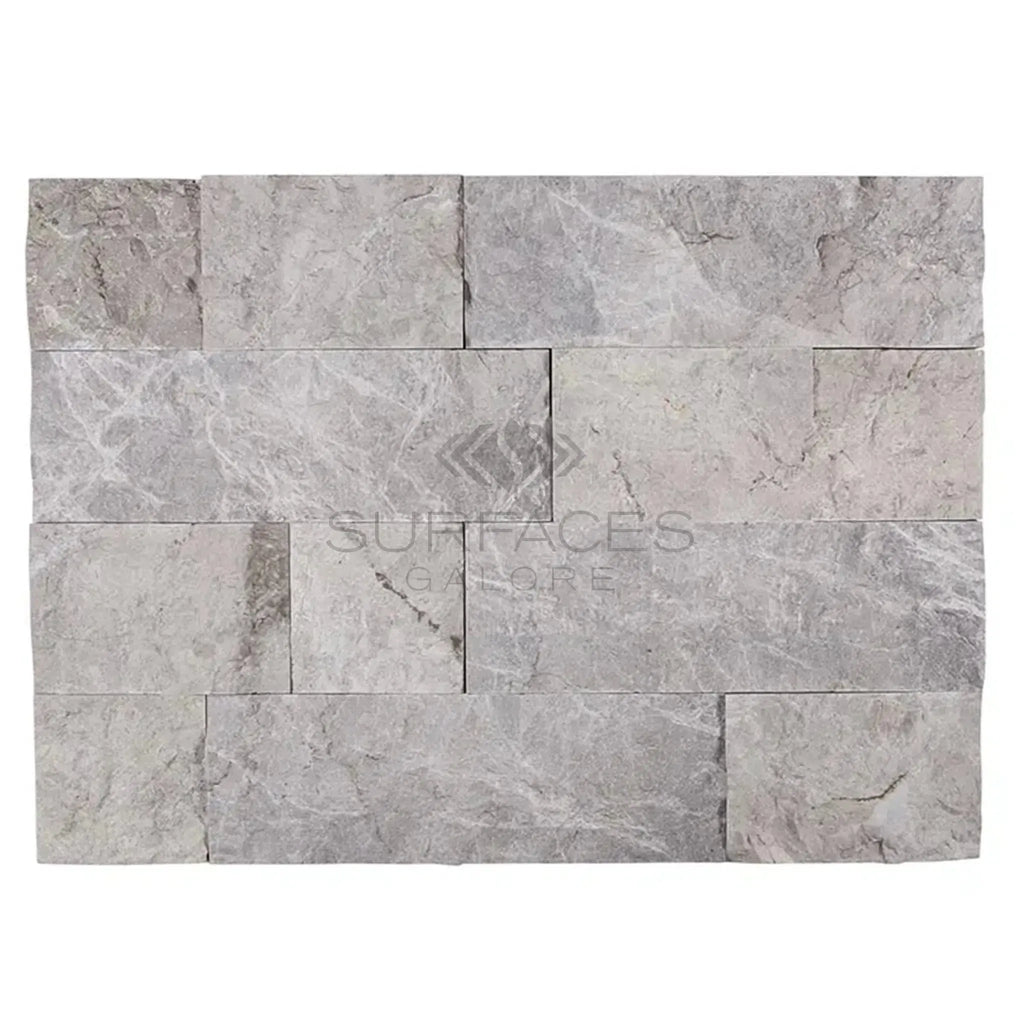 Gray stone wall panel featuring Atlantic Gray Marble 4XFree-Length Tile Split-Faced