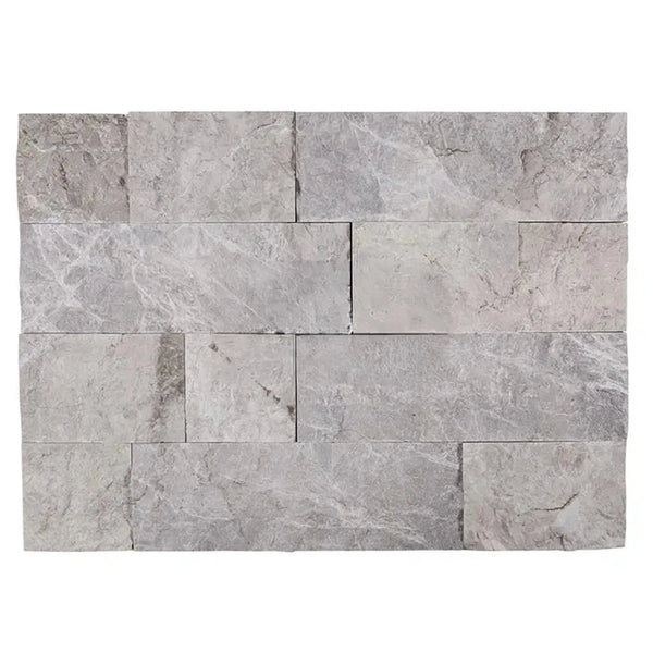 Gray stacked stone wall featuring Atlantic Gray Marble 4XFree-Length Tile Split-Faced