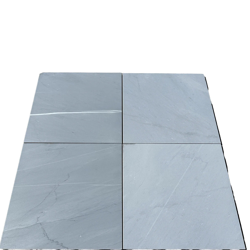 Four gray Bardiglio Imperiale 12X12 marble polished or honed tiles displayed together