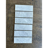 Rectangular Bianco Congelato 1/2X12 Pencil Liner Dolomite Leathered marble-patterned tiles