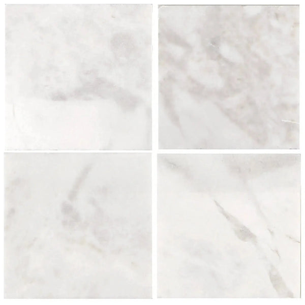 Four white marble tiles of Bianco Congelato 12X12 Dolomite Leathered product