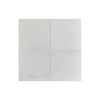 Four white square tiles of Bianco Dolomite 1/2X12 Pencil Liner Marble