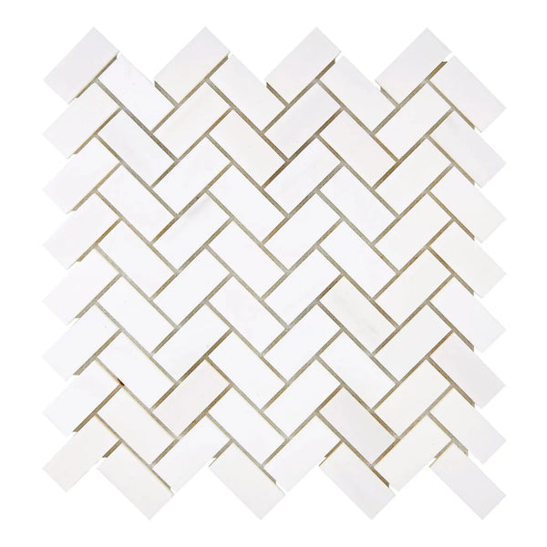 White herringbone tile pattern of Bianco Dolomite marble mosaic in honed finish