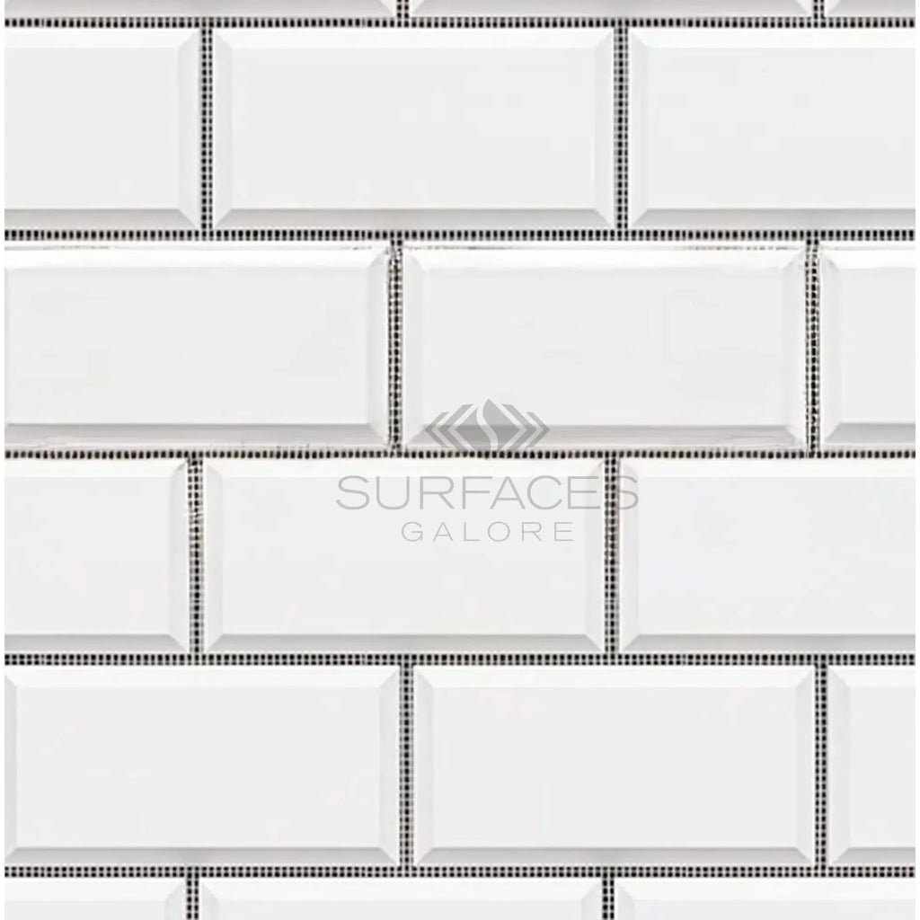 White beveled subway tile in Bianco Dolomite 2X4 brick polished-honed mosaic