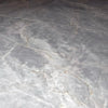 Gray marble surface with cracks in Blue Jade 24X24 Polished Tile for elegant flooring