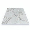 White marble tile arrangement featuring Calacatta Gold 1/2X12 Pencil Liner polished finish