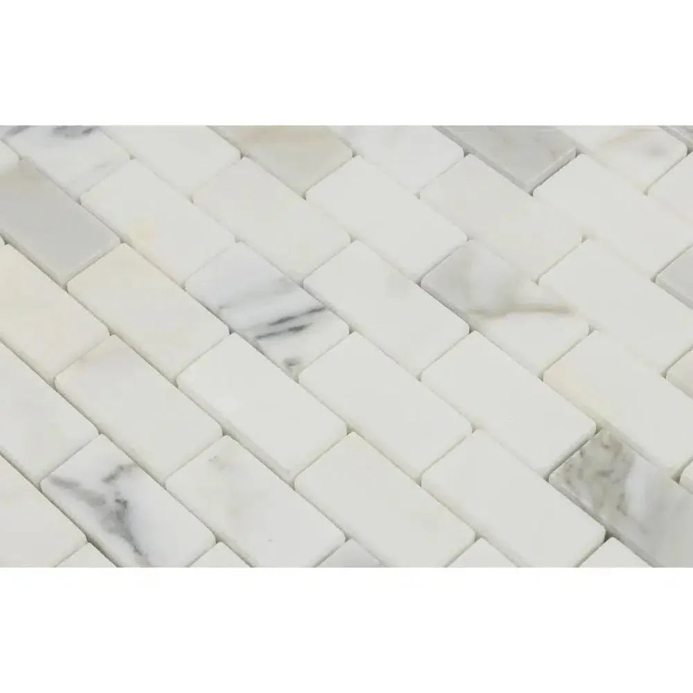 Calacatta Gold 1x2 Brick Mosaic Marble Tile in polished white marble herringbone design