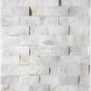 White stacked stone wall featuring Calacatta Gold 1X2 Brick Split-Faced Mosaic Marble Tile