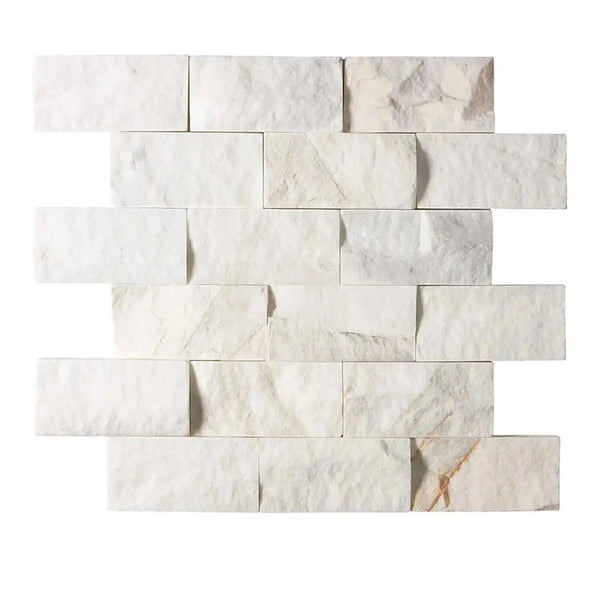 Calacatta Gold 2x4 Brick Split-Faced Mosaic Marble Tile on a white marble brick wall