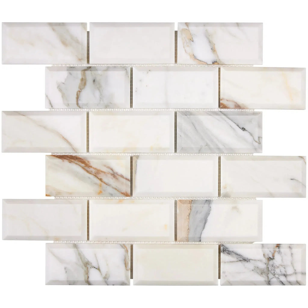 Marble-patterned rectangular tile mosaic of Calacatta Gold 2X4 Deep-Beveled Brick Tile