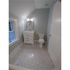 Elegant bathroom interior featuring Carrara White 1/2X12 Pencil Liner Polished fixtures