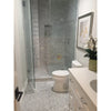 Modern bathroom featuring a glass shower with Carrara White 1X1 Mosaic Marble Tile