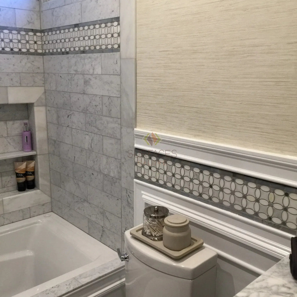 Bathroom featuring polished Carrara White 1X2 Brick Mosaic Marble Tile with decorative border