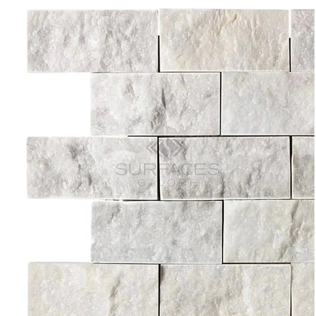 Carrara White 2X4 Brick Mosaic Marble Tile Split-Faced featuring a white stone brick wall