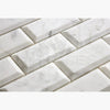 White marble beveled subway tiles from Carrara White 2X4 Deep-Beveled Brick Mosaic